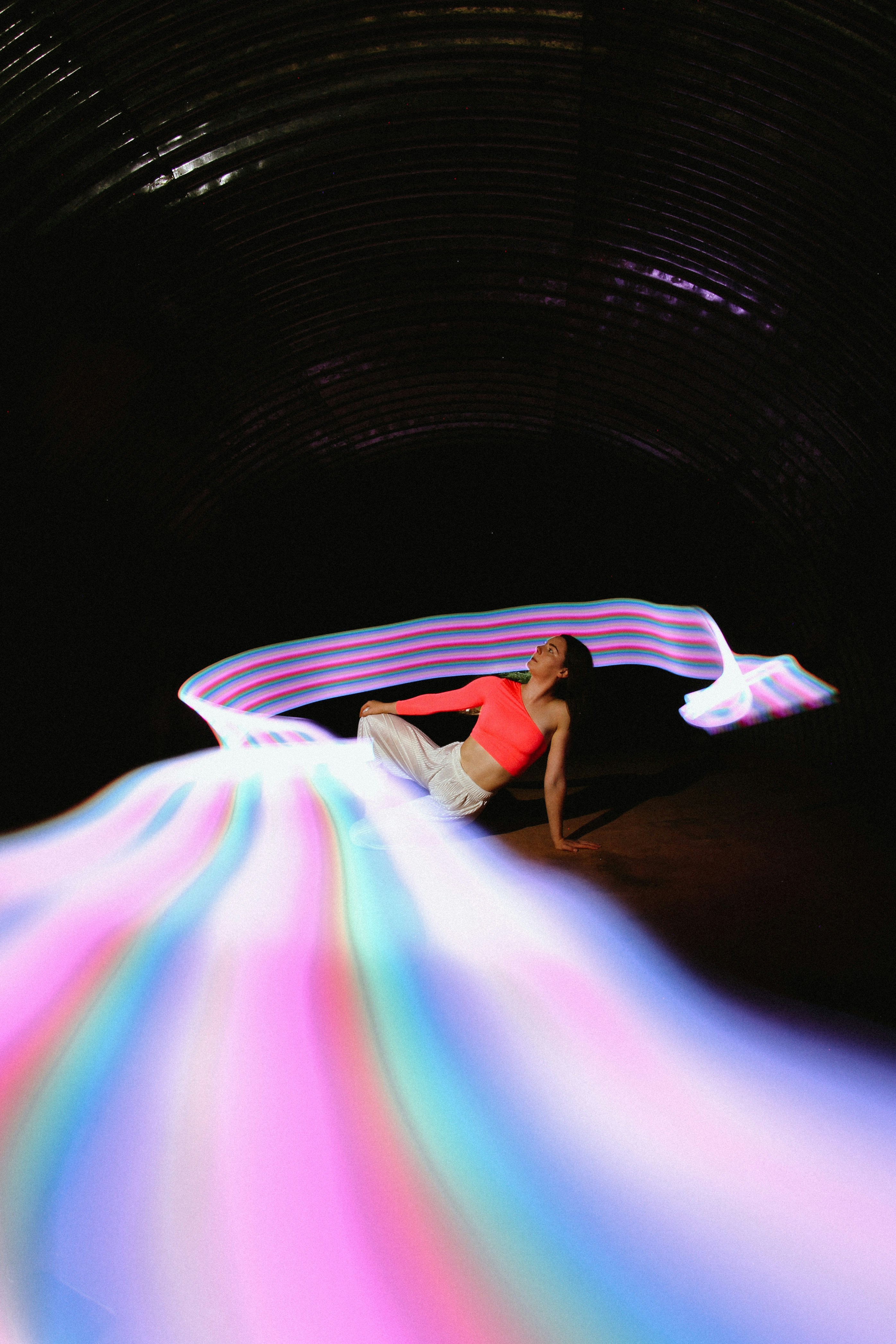 a person lying on a colorful circle