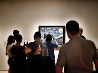 a group of people looking at a screen