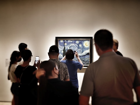 a group of people looking at a screen