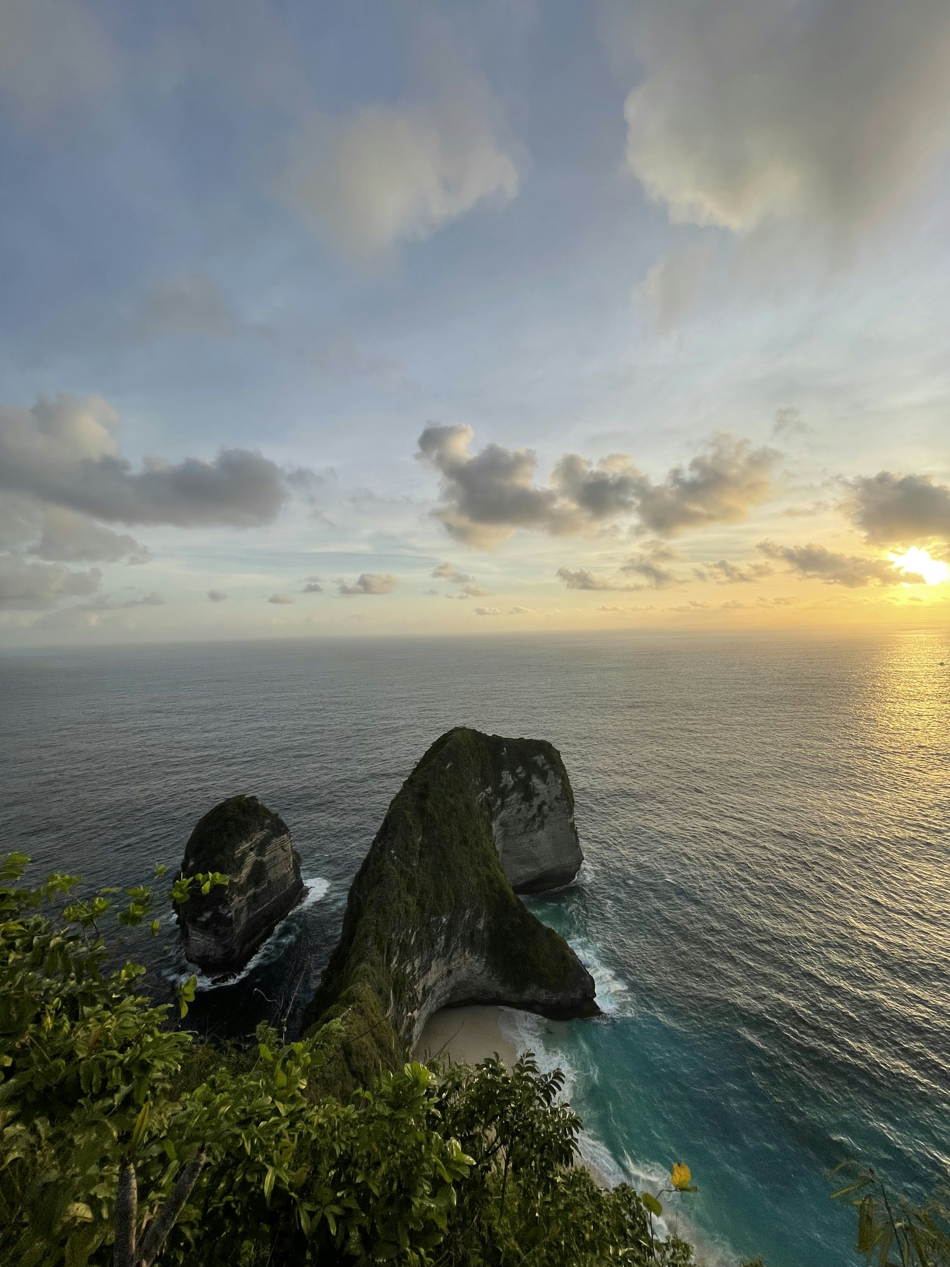 a rock on a cliff above the ocean