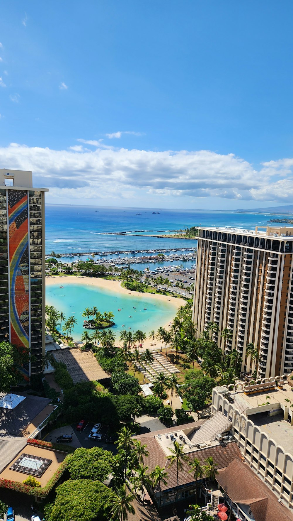 a beach with buildings and trees