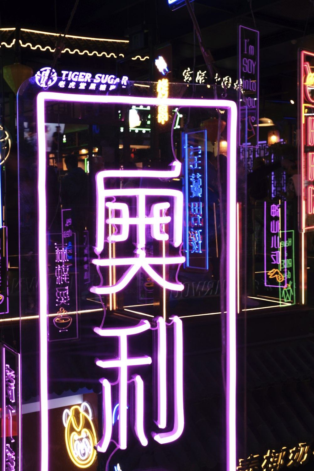 a neon sign in a city