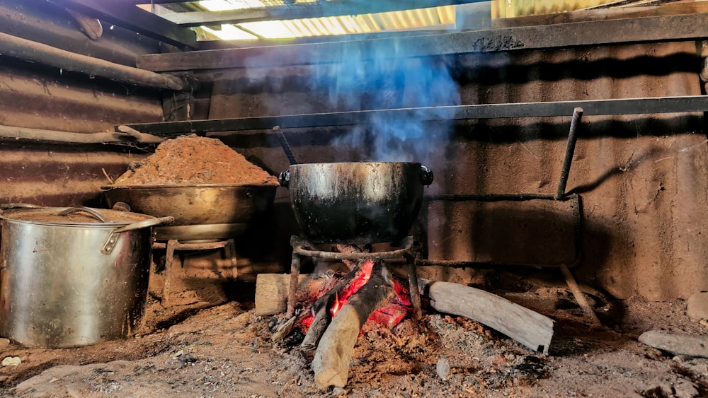 a large metal pot with a flame