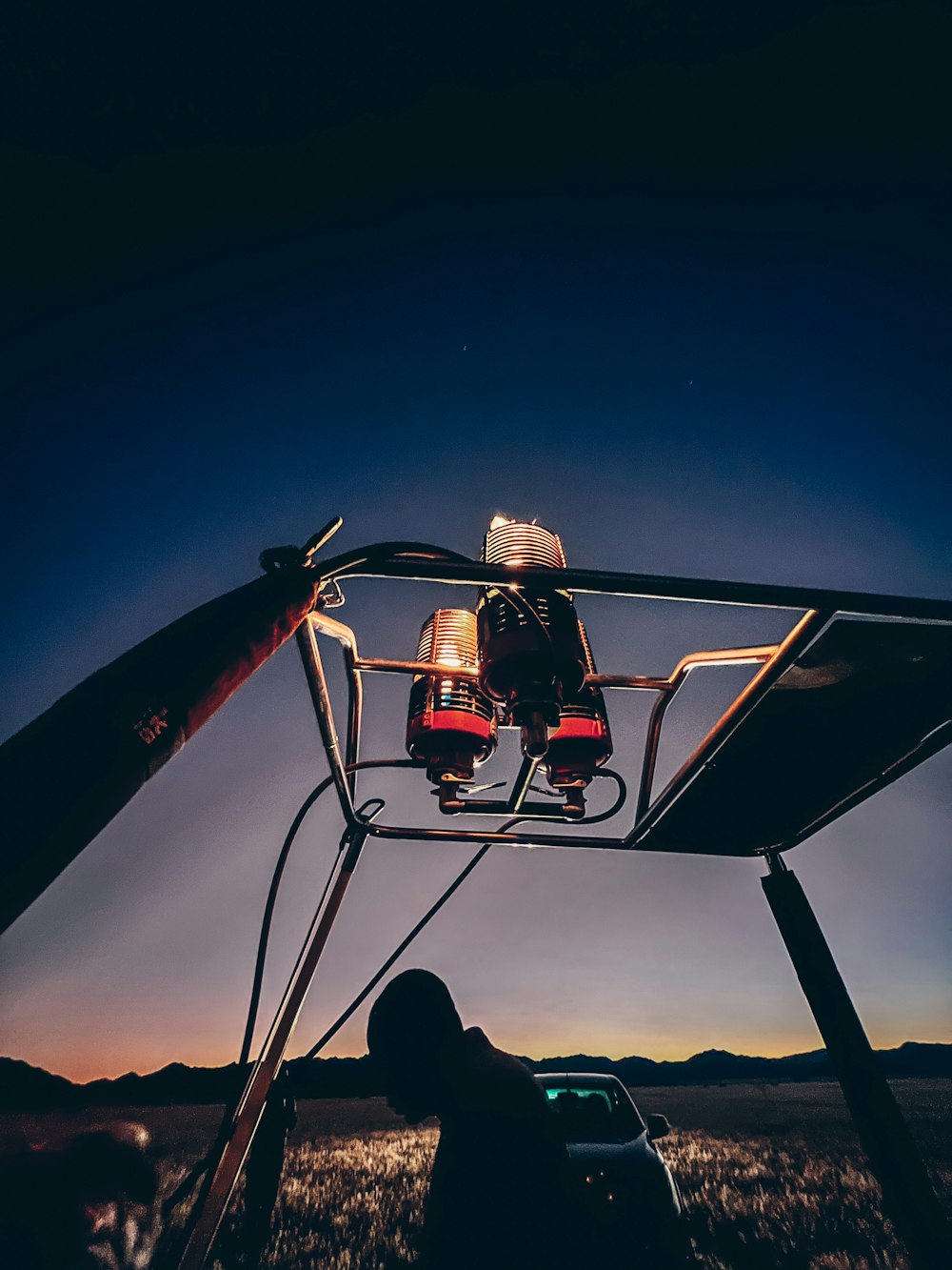 a person on a roller coaster at night