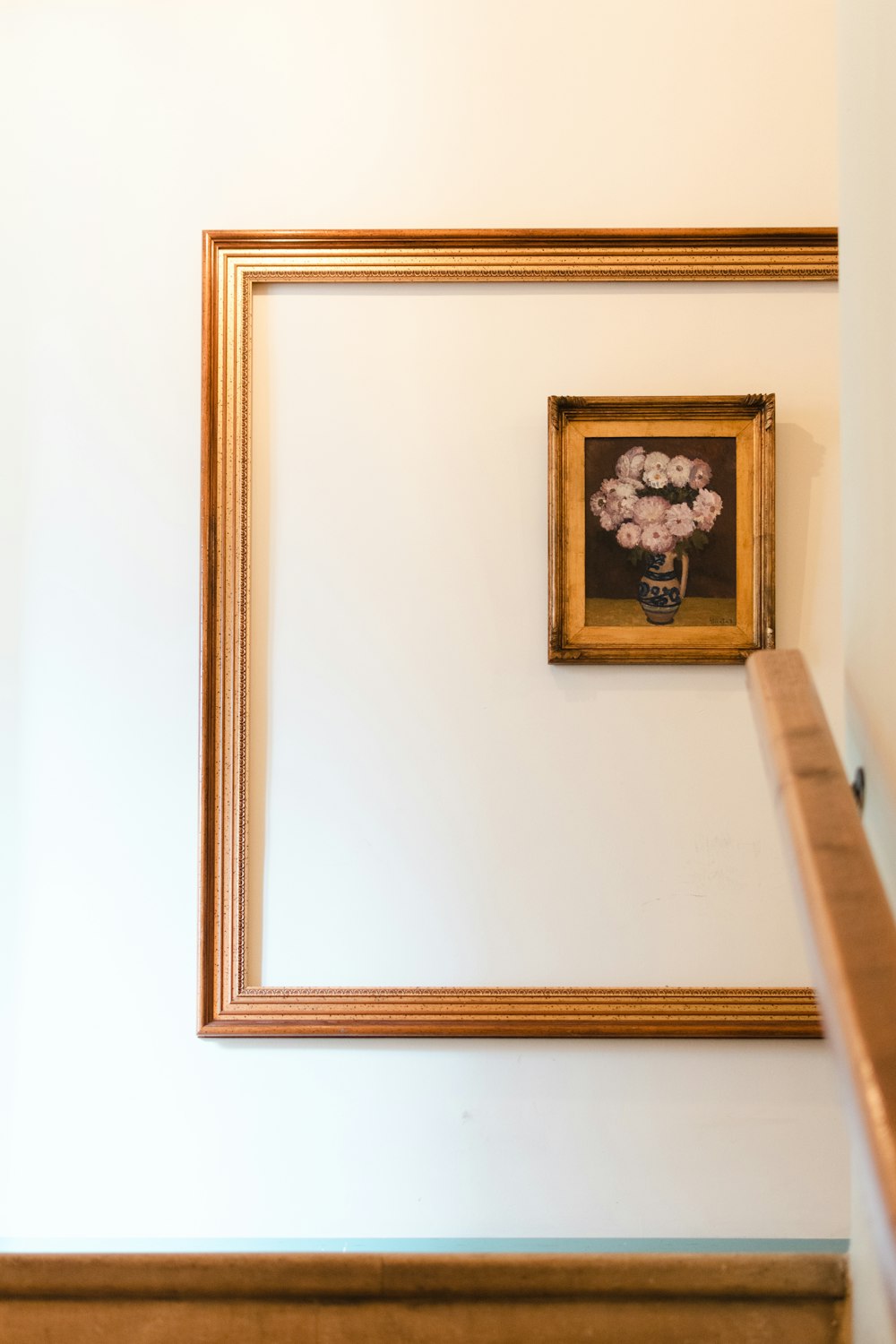 a framed painting on a wall