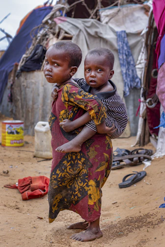 a person carrying a baby
