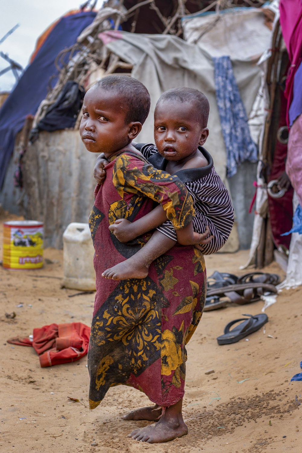 a person carrying a baby