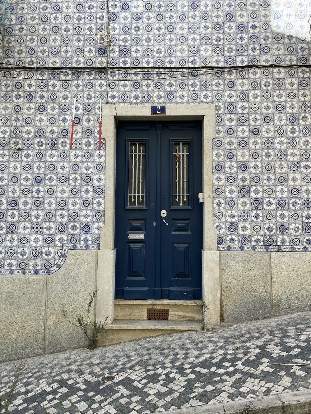 a blue door on a stone building