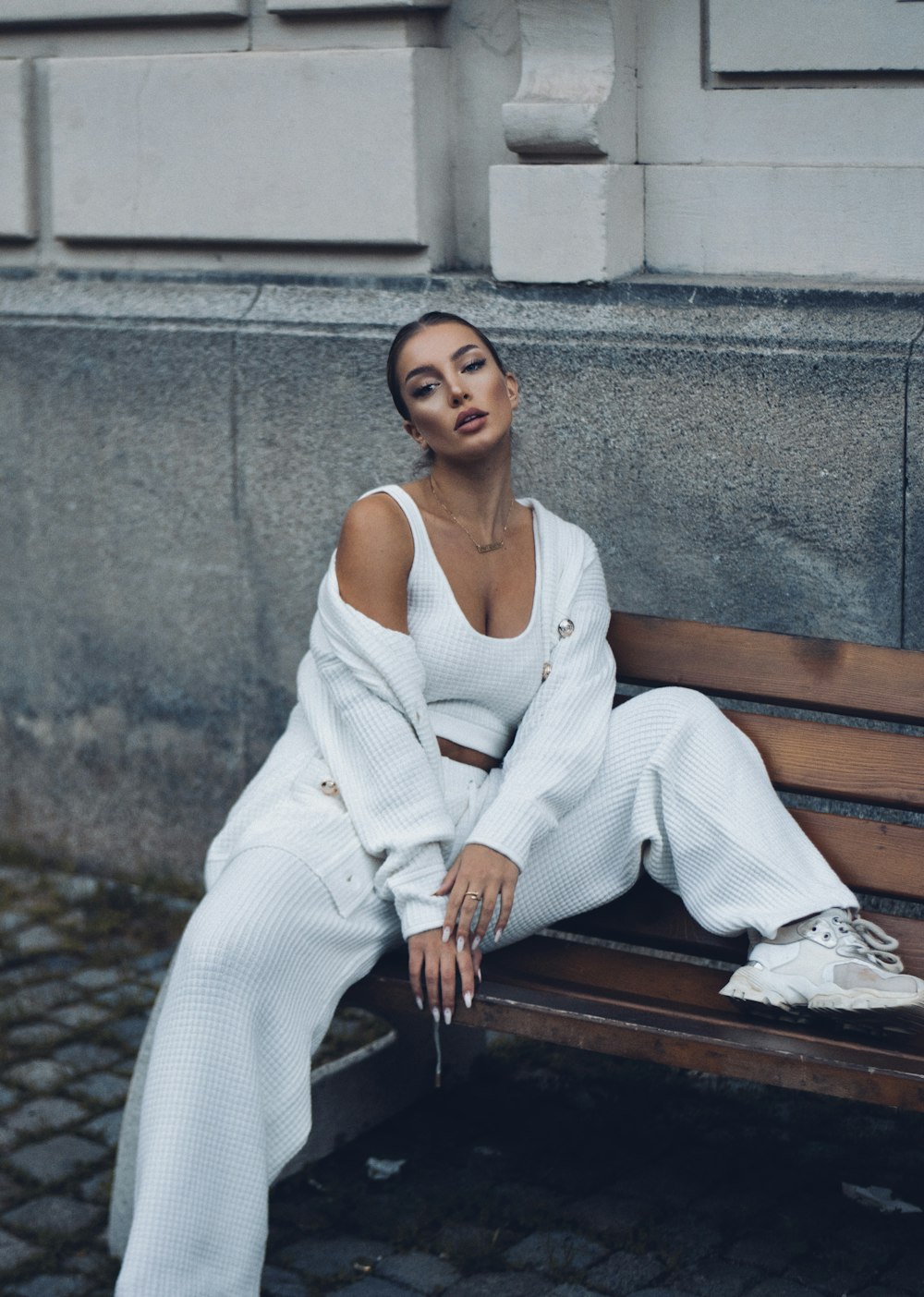 a woman sitting on a bench