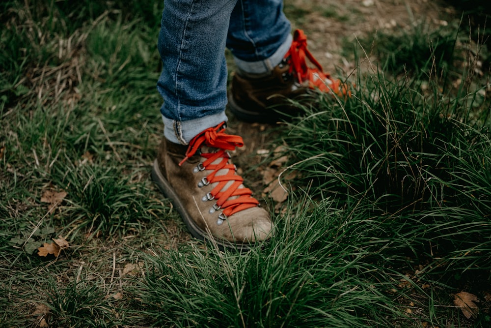 a person's feet in a grassy area