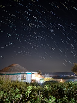 a house with a starry sky above it