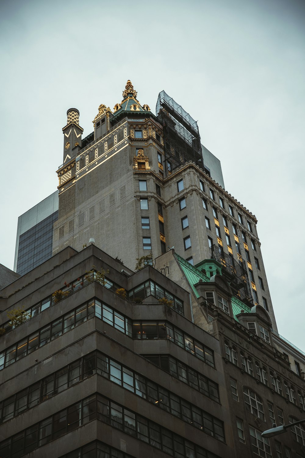 a tall building with a green sign