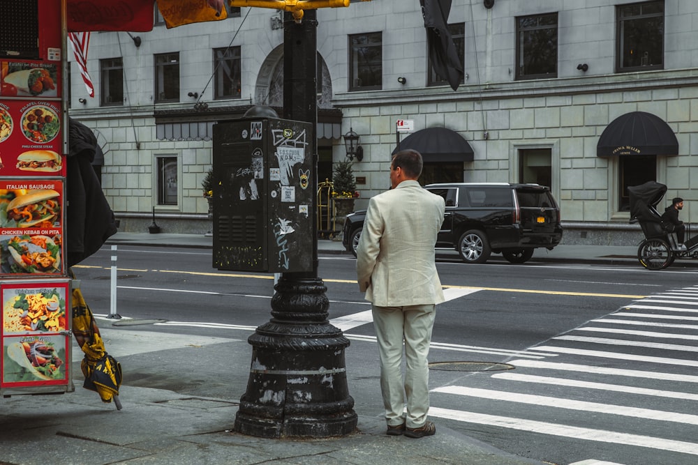 a person standing in the middle of a crosswalk