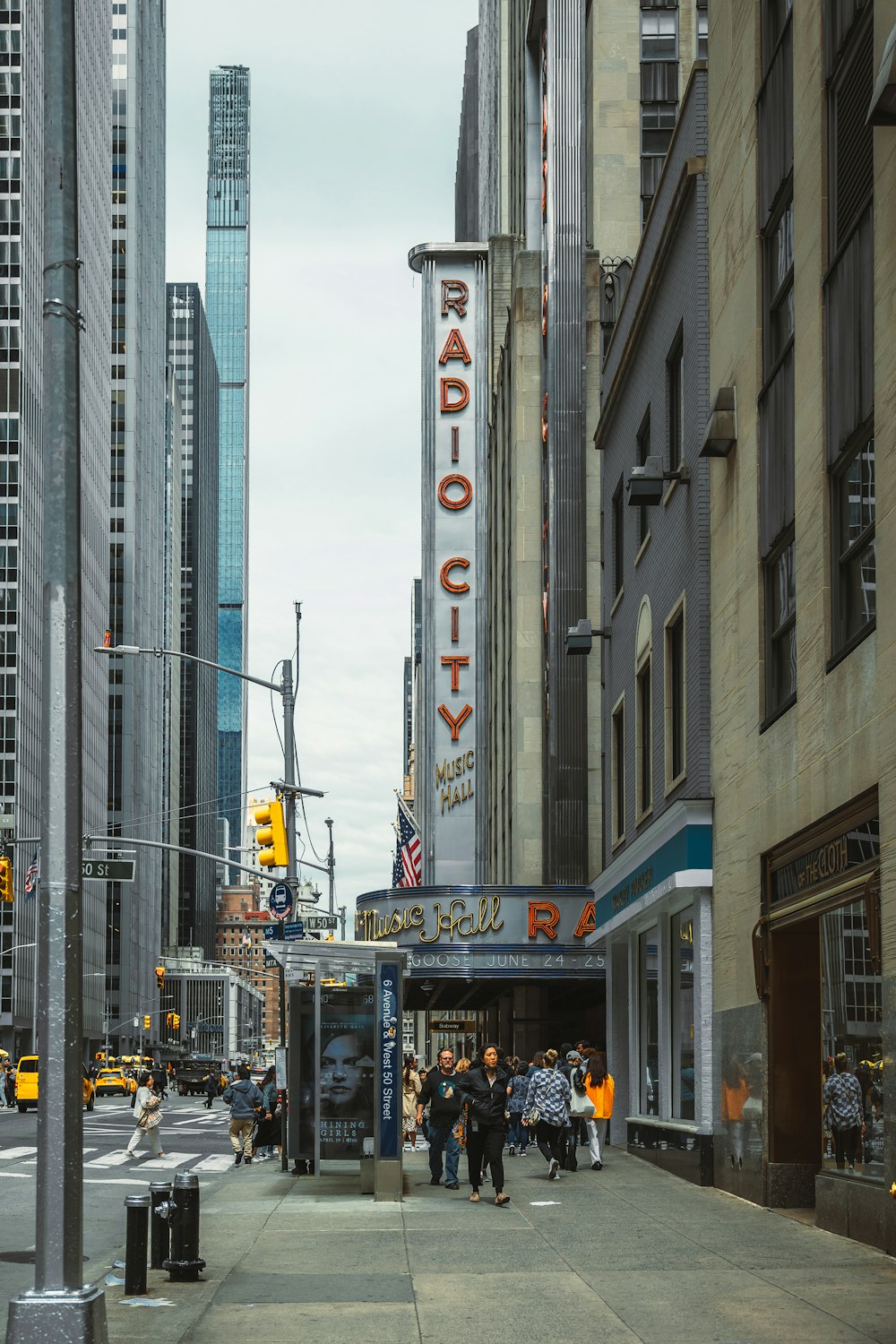 a city street with people walking