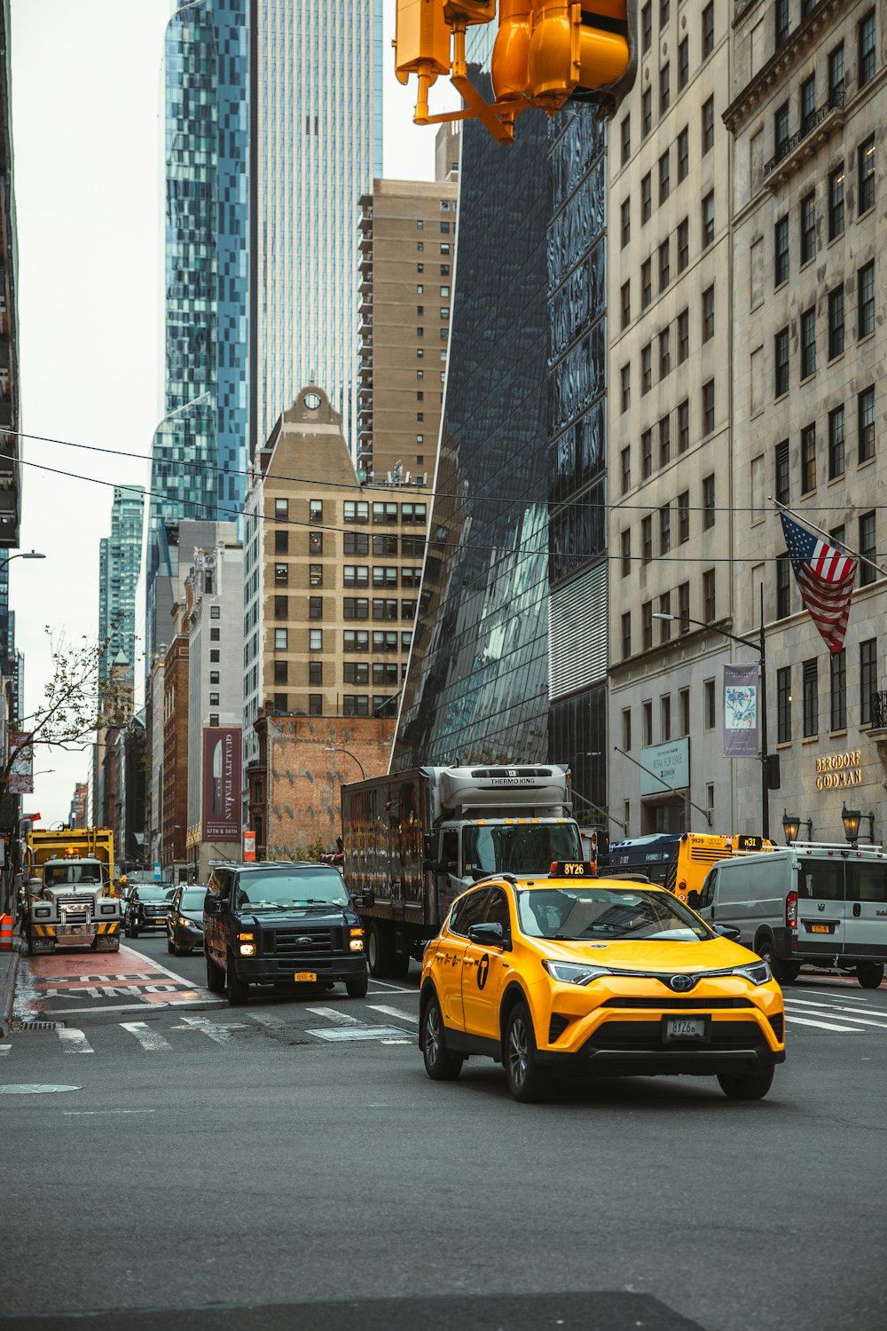 a yellow taxi on a busy street
