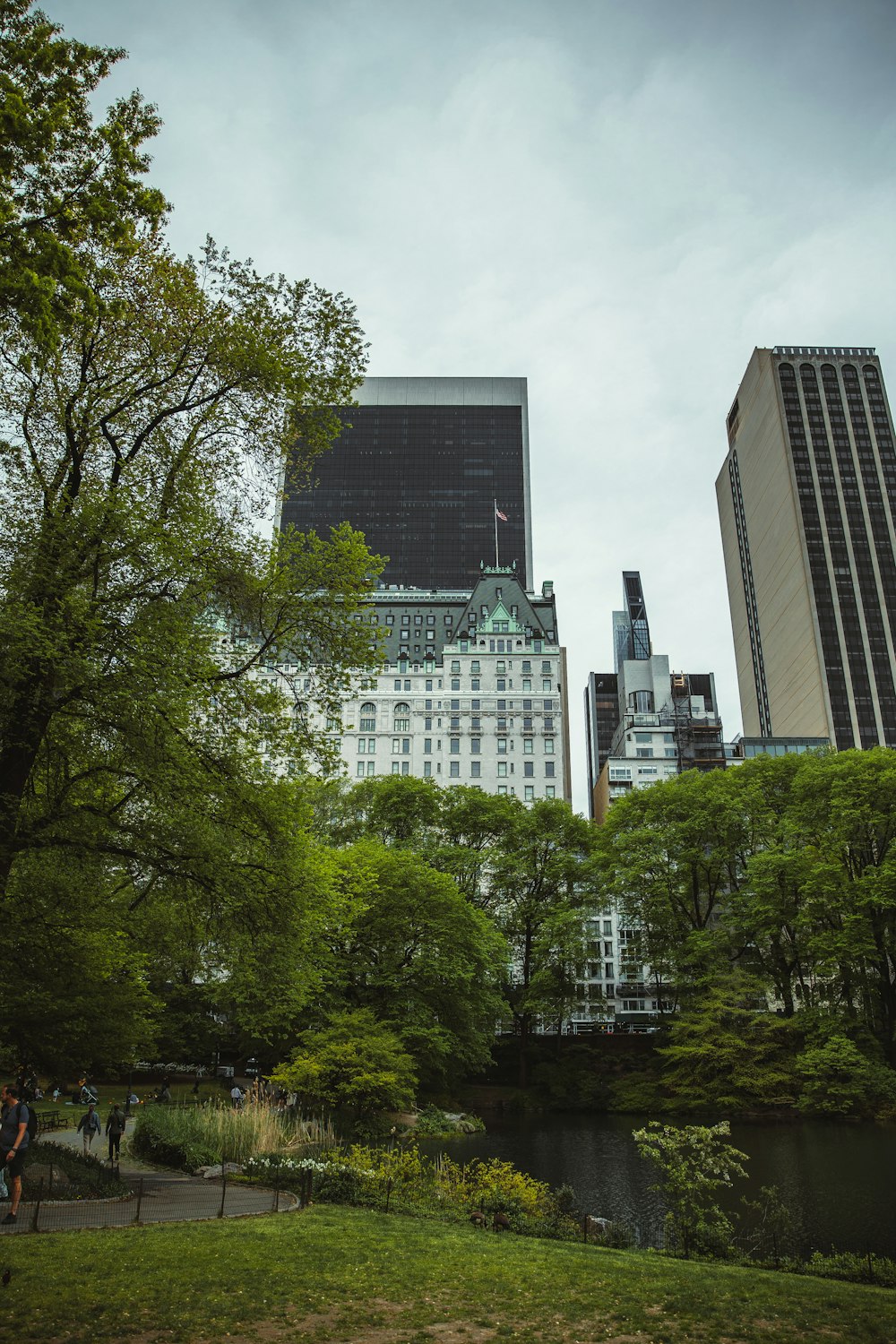 a group of buildings with trees in front of them