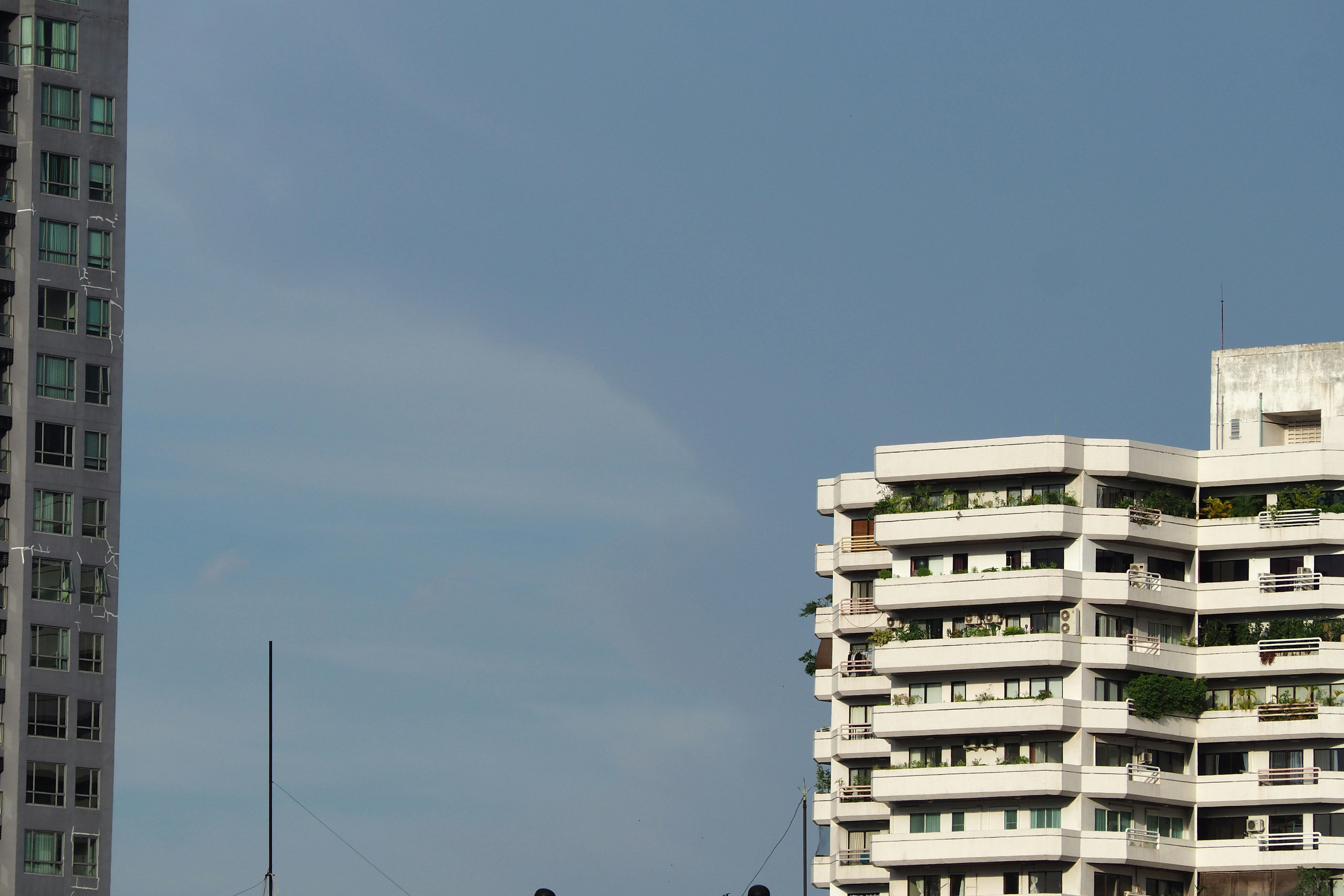a blue sky above buildings