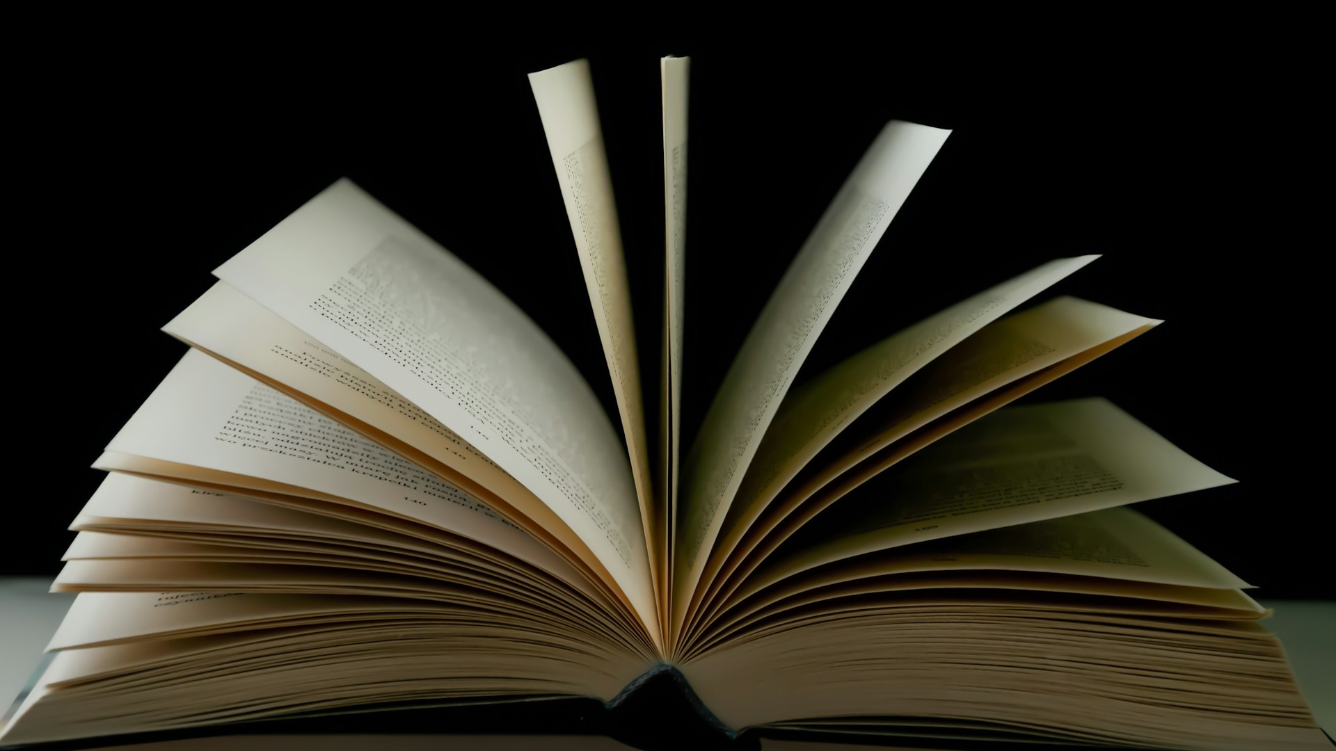 a stack of open books