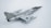 A model aircraft with a sleek, metallic design, featuring jet engines and distinctive military markings. The aircraft has dual wings and pointed nose with noticeable detail in its construction. The backdrop is a plain, light-colored surface that highlights the aircraft's shiny surface.