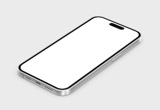 A smartphone with a sleek metallic frame and a white screen is positioned at an angle on a plain background. The phone features a side button, speaker grills, and a charging port at the bottom.