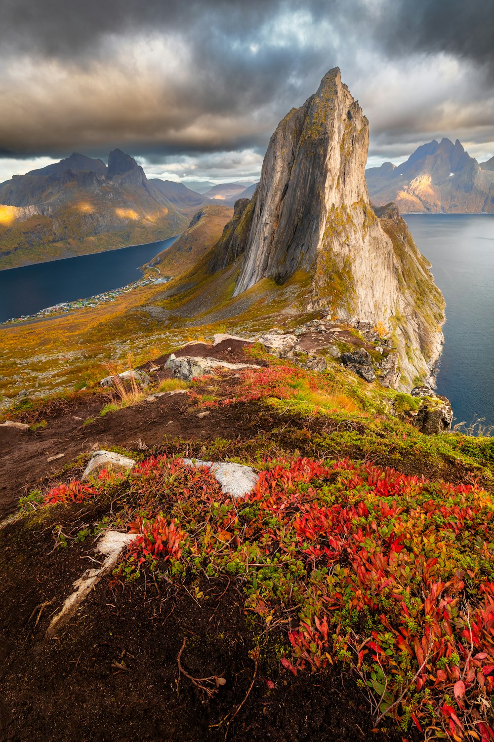 a mountain with a body of water below