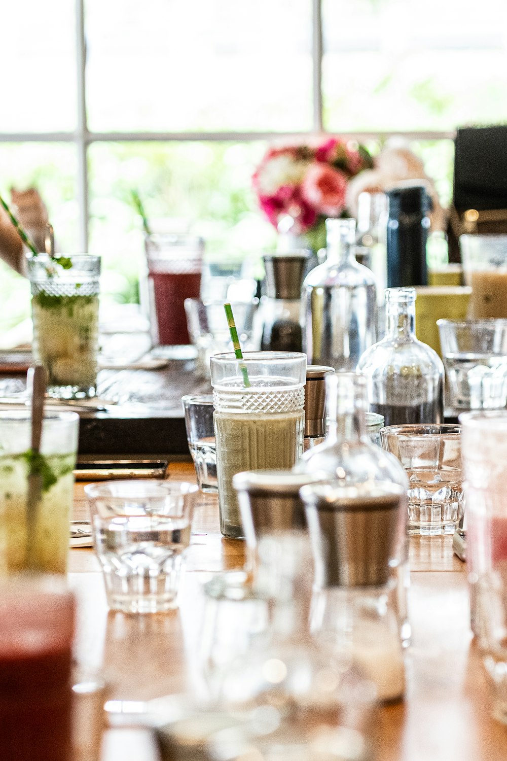 a table with glasses and bottles of liquid on it