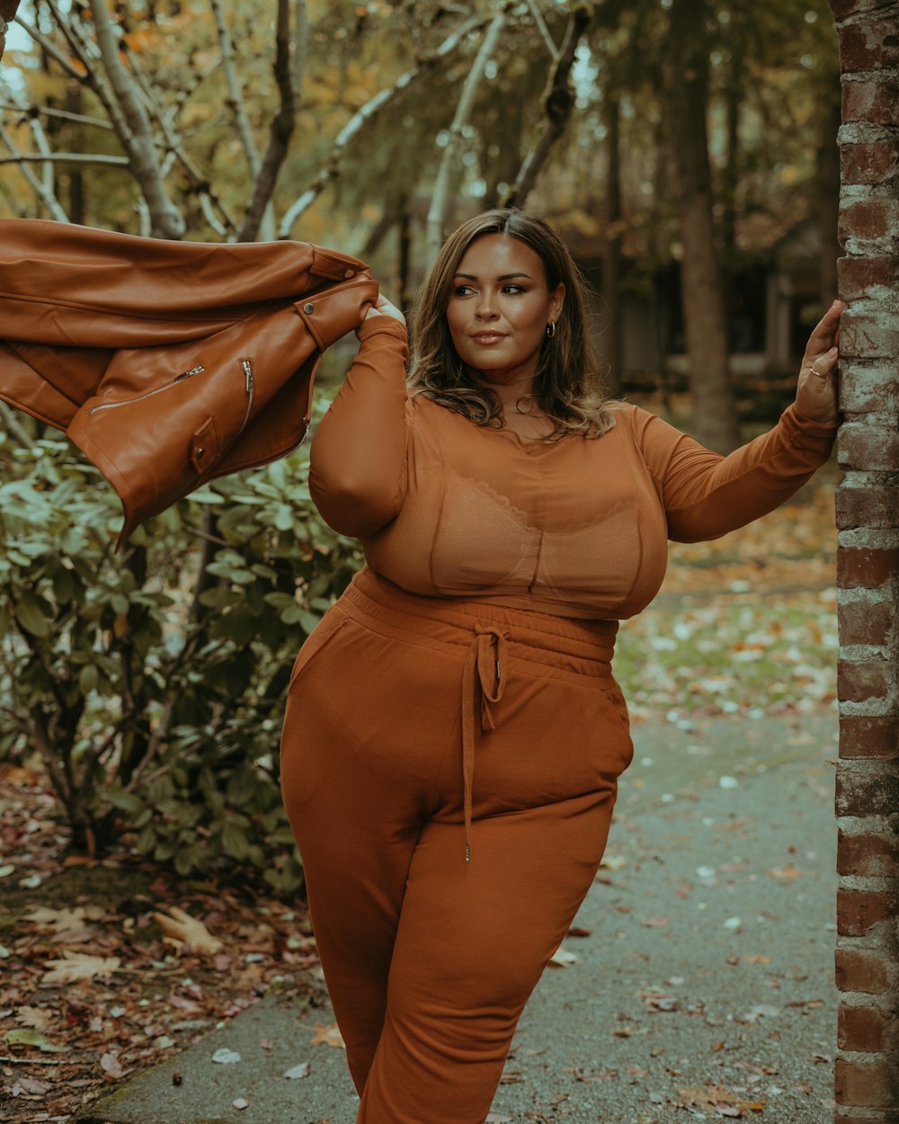 a woman wearing a brown dress