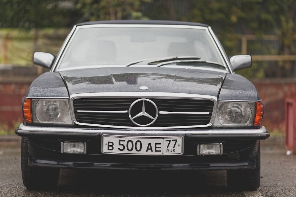 a black car with a white license plate