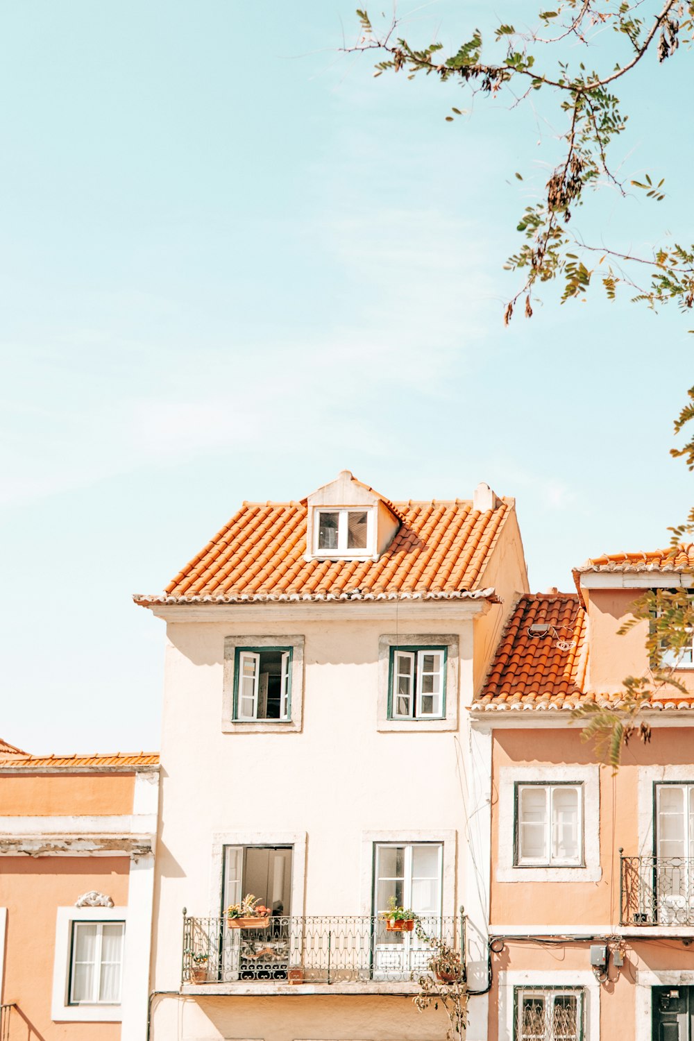 a white building with a red roof