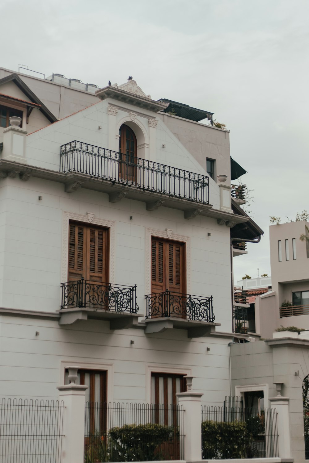 a white building with a balcony