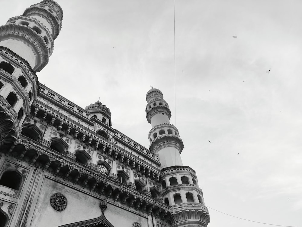 a bird flying over a building