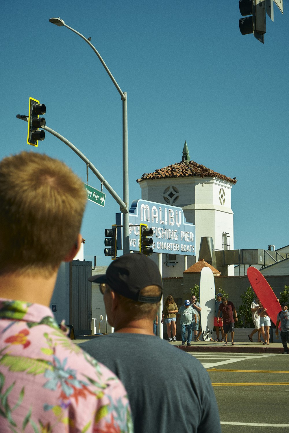 people waiting at a traffic light