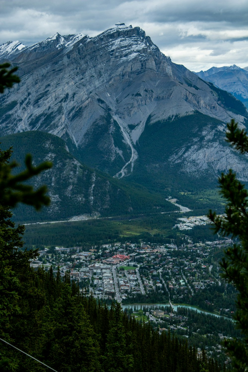 a large waterfall in a valley between mountains