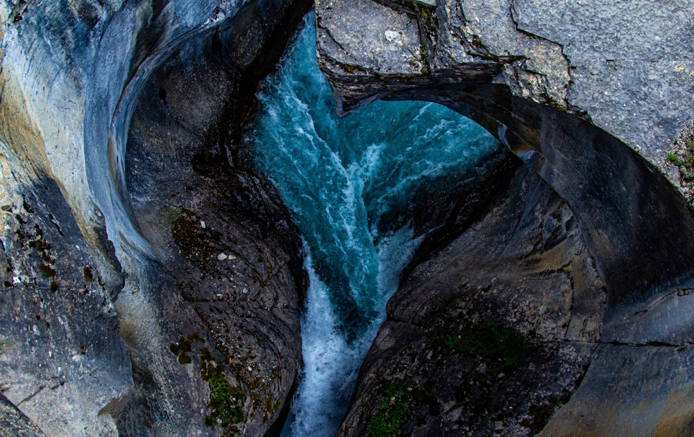 a waterfall over a rock