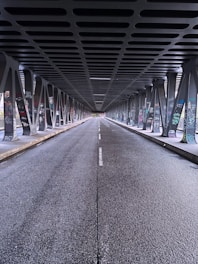 a long hallway with metal railings