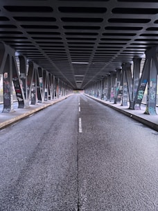 a long hallway with metal railings