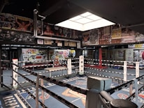 a large room with many signs and a large metal object in it