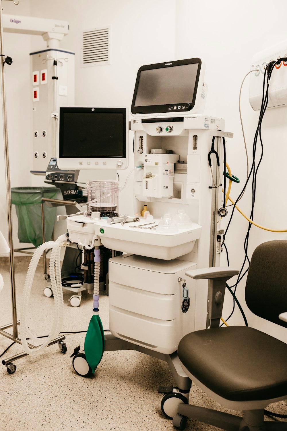a room with a computer and medical equipment