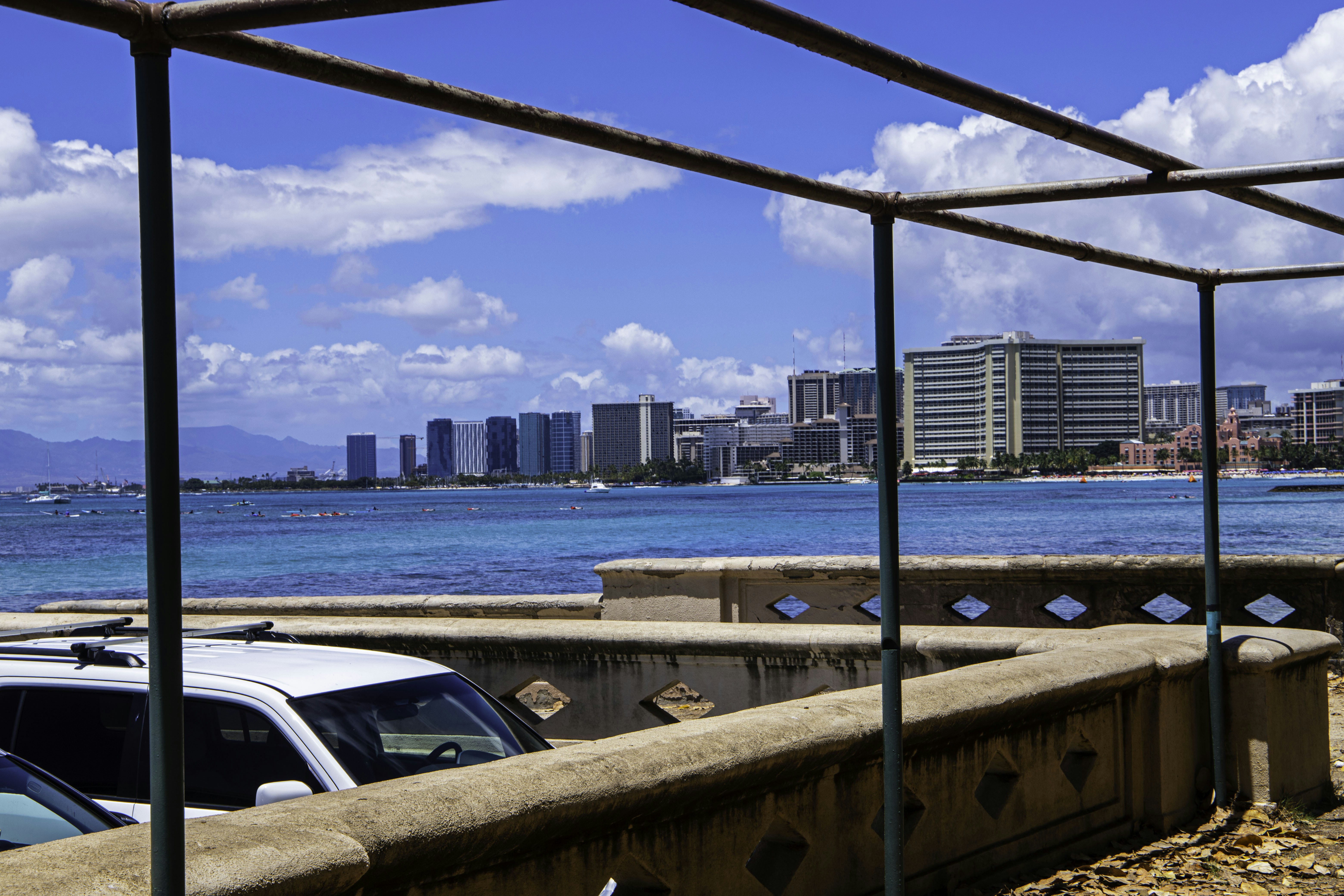 a metal frame with a city skyline in the background