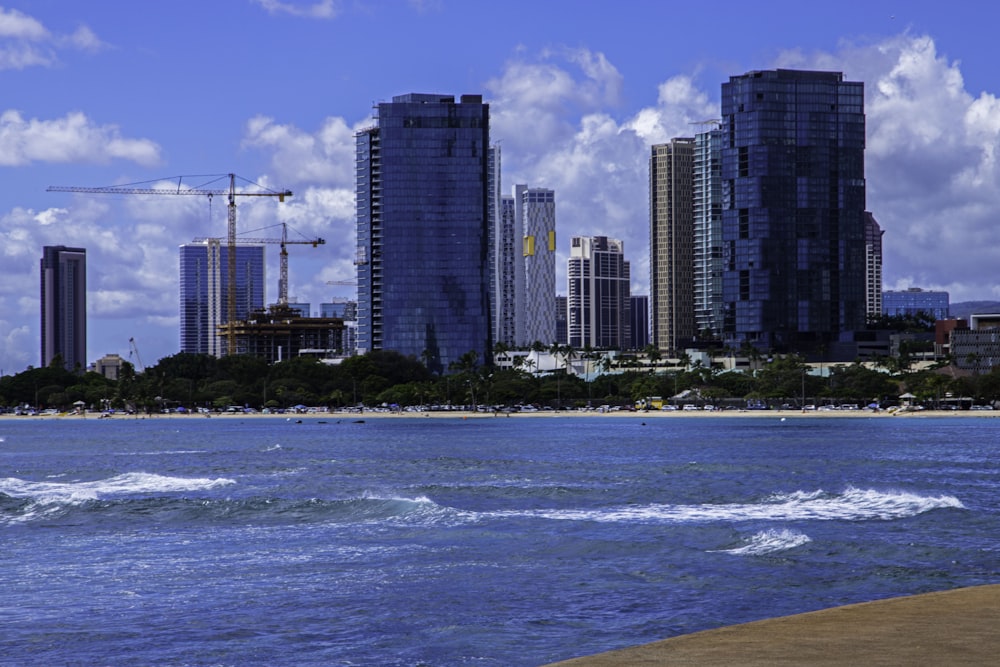 a city skyline with cranes