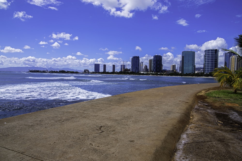 a beach with a city in the background