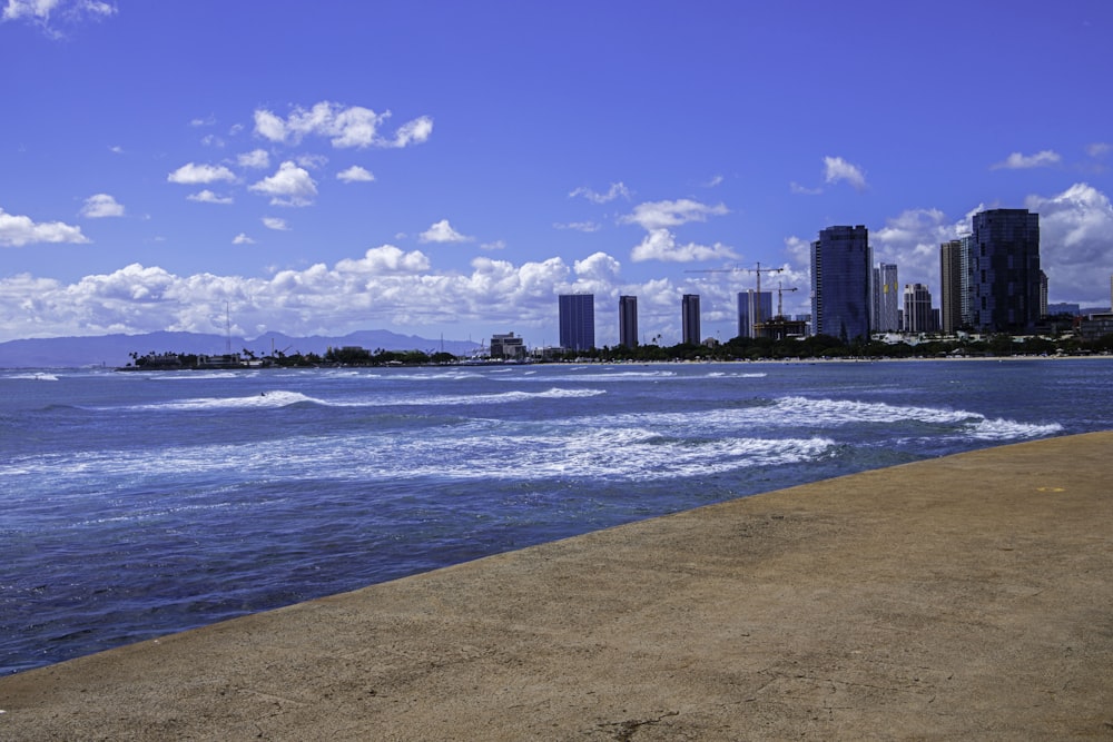 a beach with a city in the background