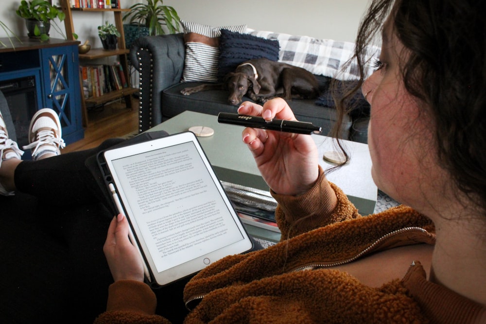 a man holding a gun and a book