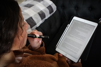 a woman writing on a book