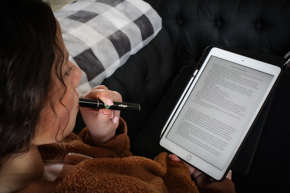 a woman writing on a book