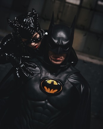 Batman suit with dark cape, detailed mask, and symbol on chest.