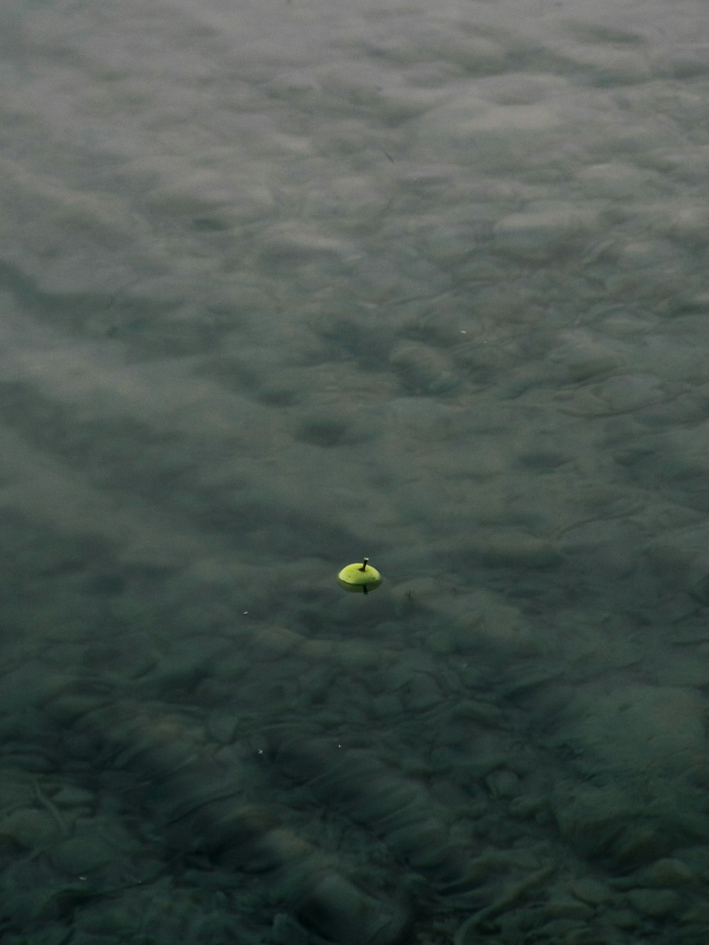 a yellow object floating in the air