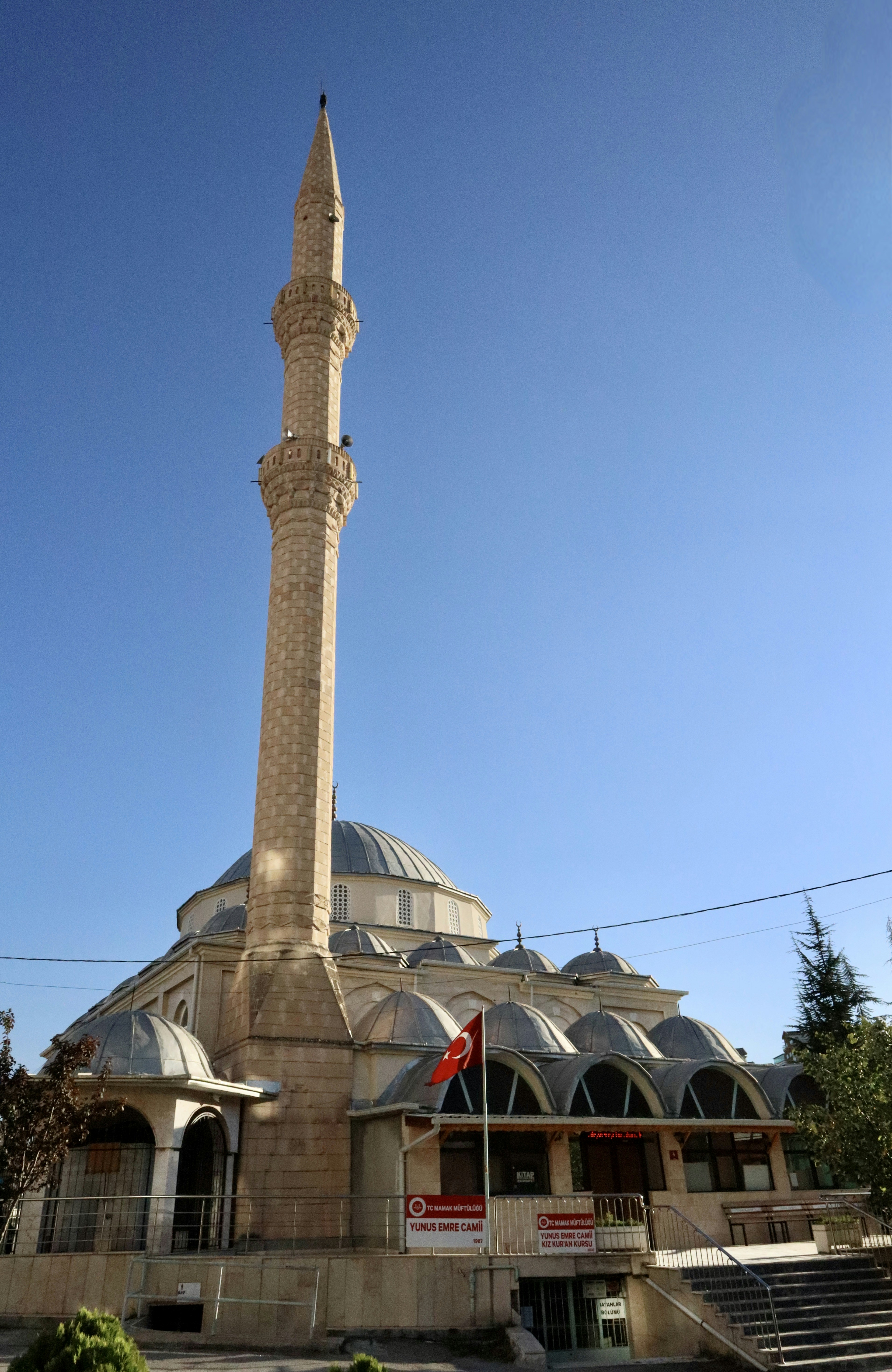 a tall tower with a flag