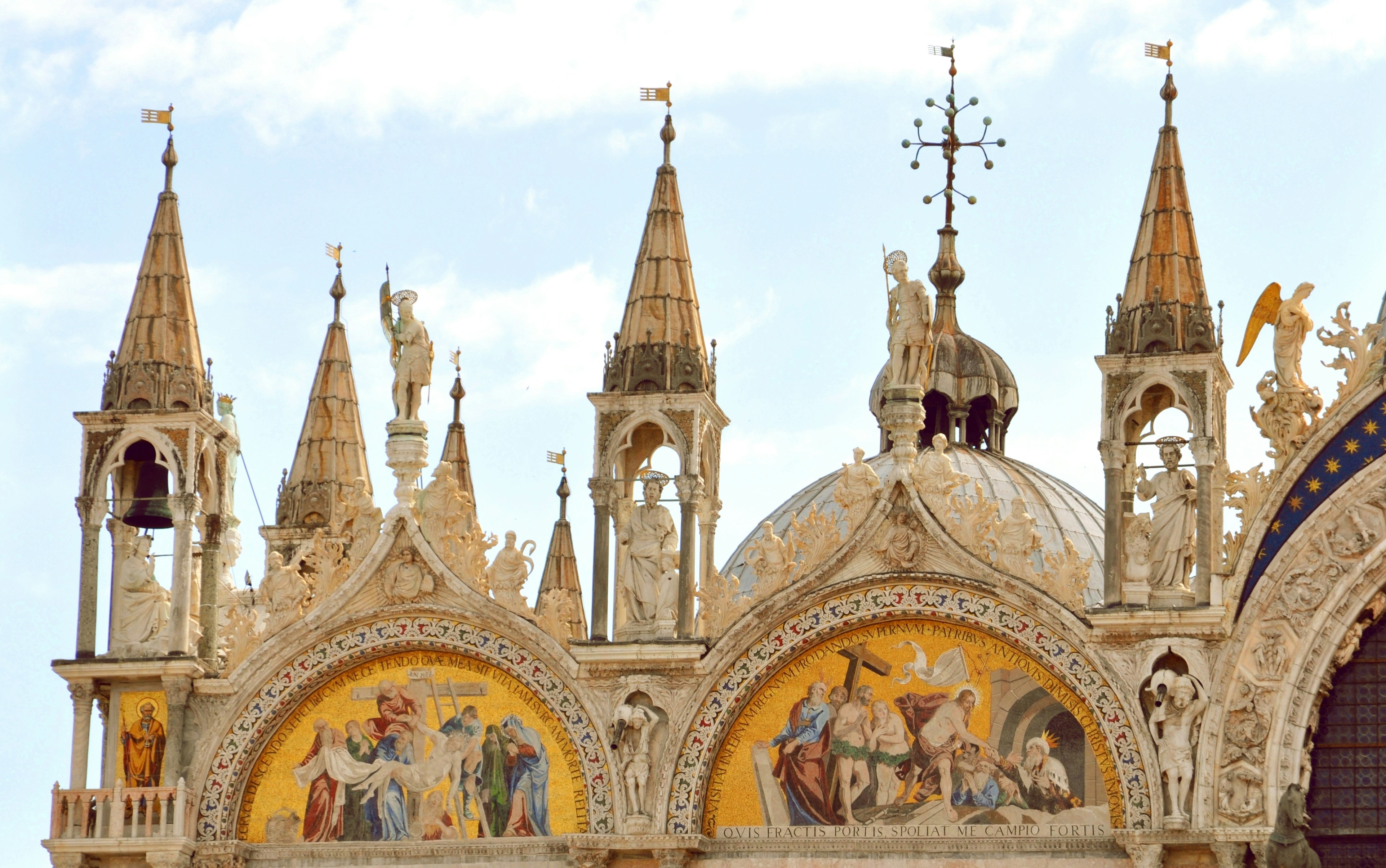 Shwedagon Pagoda with a large mural on the side