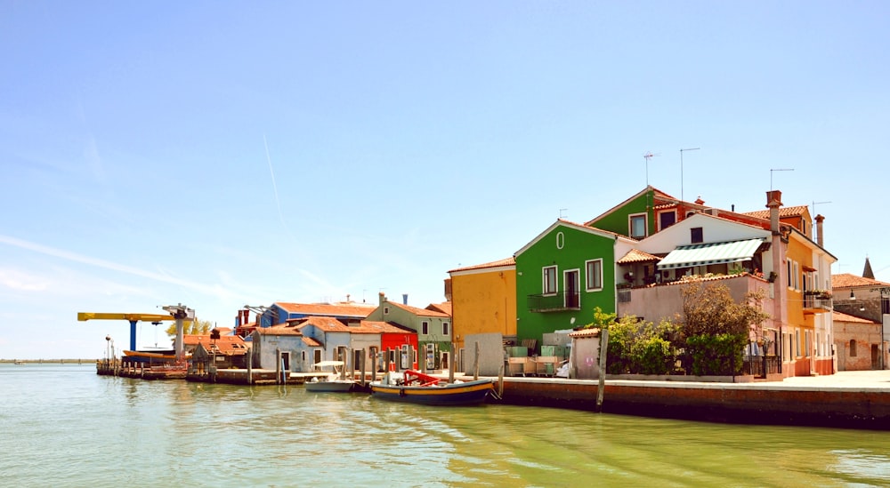 a row of colorful buildings on the water